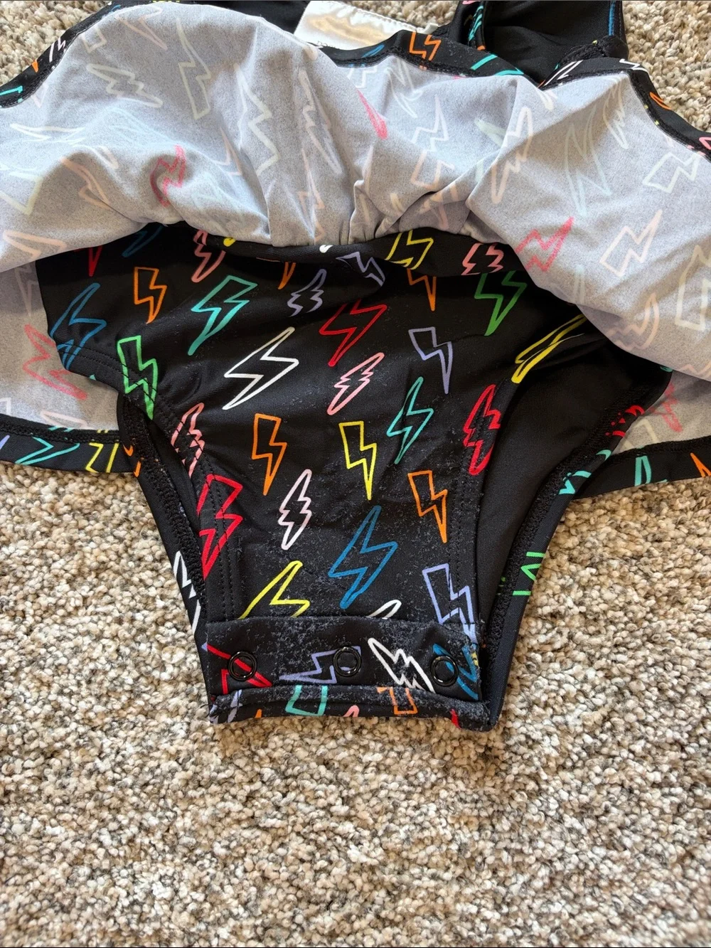 Posh Peanut Black Lightning Bolt Peplum Swimsuit with Multicolor Bolts